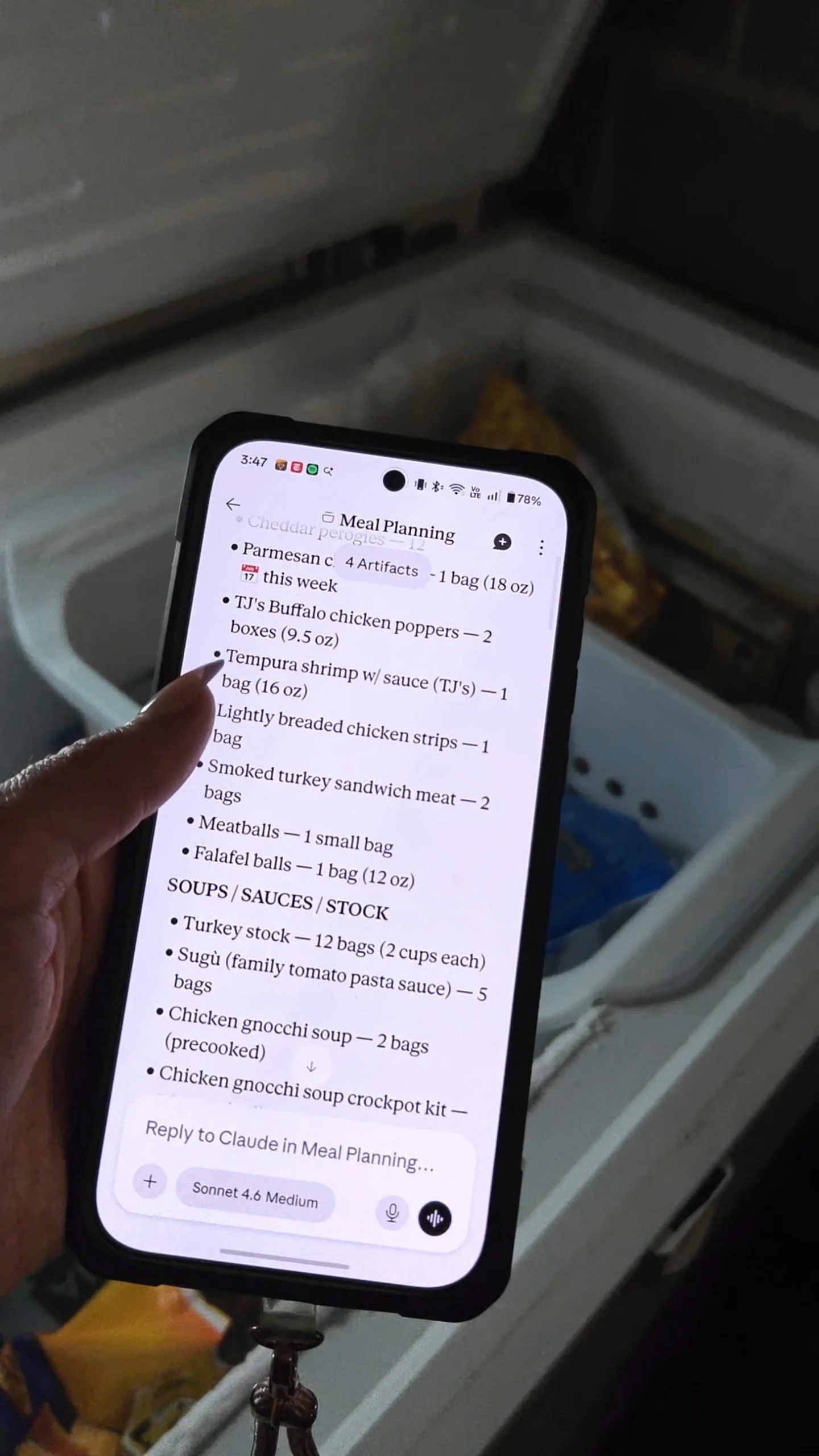 A phone screen showing an AI meal planning chat holding the freezer inventory, with counts for each item.